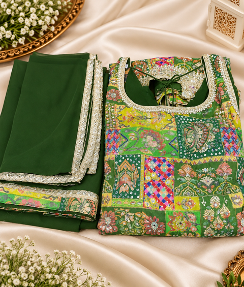 Silk-blend patchwork kameez with mirror & stone work, paired with a flowy circular palazzo and plain georgette dupatta with golden border. Slight variation in colour/design possible