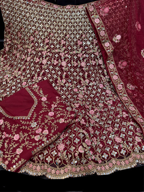 Deep Maroon colour netting based heavy embroidery jaal with mirror work multiflared beautiful bridal lehnga