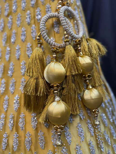 (Video clip attached)SIZE 42 (Upto 46))Lite Mint colour netting Based Beautiful Embroidery Work With Golden Fine Stones& beaded pearl work Very Heavy Layered Designer semi/Bridal Lehnga With Heavy Tessels Attached To Blouse & Lehnga