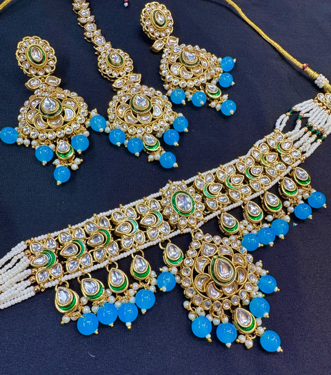 Beautiful Kundan and pearls work classy choker set with beautiful earrings & Tikka