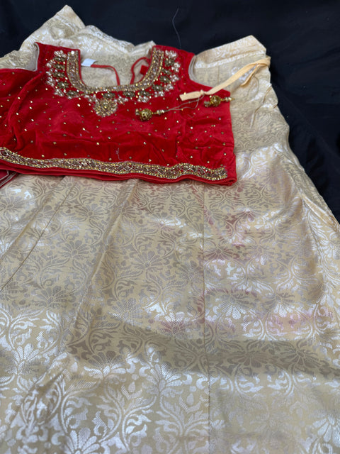 Red colour velvet based stone work blouse with brocade silk lehnga(some red color shades on lehnga )