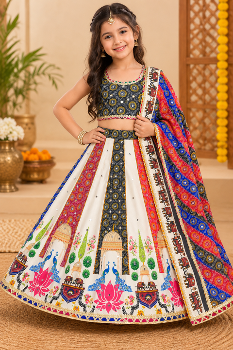 Kids Crepe Silk Lehenga Set with beautiful mirror work and vibrant traditional prints.Soft, lightweight and comfortable—perfect for weddings, festivals and special occasions.(slight variation in color & design is possible )