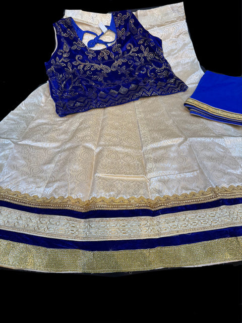 velvet based stone work blouse with golden with pink and red shades on raw silk based lehnga