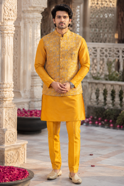 Elegant Mustard Yellow Kurta Set with Designer Woven Jacket – A timeless mustard yellow kurta set paired with a premium woven Nehru jacket, perfect for weddings and festive celebrations. Slight variation in color and design may occur.