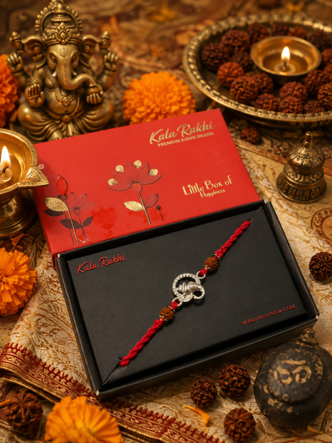 Beautiful Ganesha Rakhi featuring a spiritual centrepiece, Rudraksha beads and elegant gold accents. A meaningful choice to celebrate Raksha Bandhan with blessings, love and tradition.