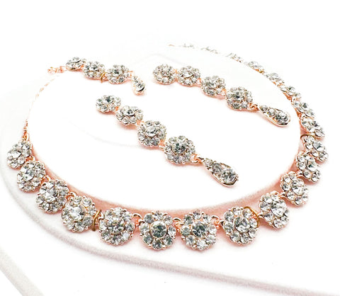 Rose gold color Jerkan stone studded beautiful necklace set with Earrings & Tikka