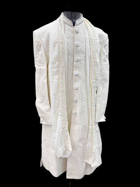 (Video clip attached )Cream color heavy embroidery & sequined work all over with hand work pearl beaded neck, buttons and sleeves design Sherwani and Pants
