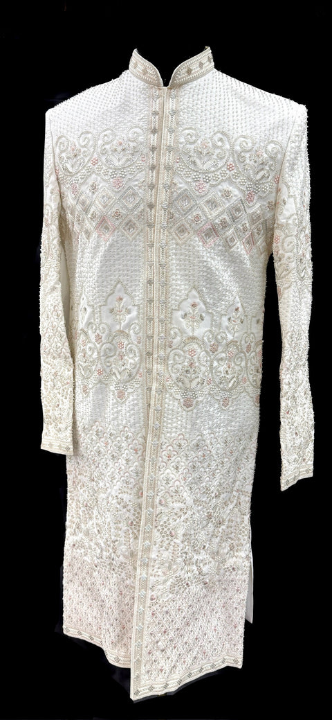 (Video clip attached )Cream color heavy embroidery & pearl sequined work all over with hand work pearl beaded neck, buttons and sleeves design Sherwani and Pants(waist belt for dupatta)