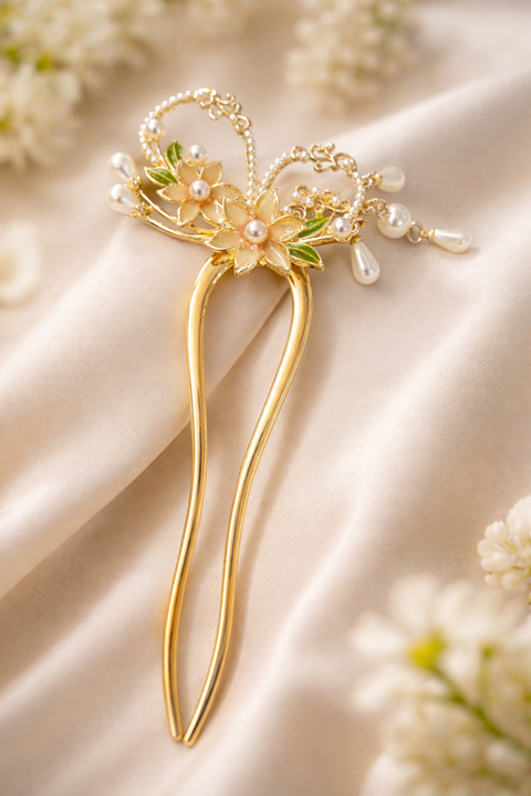 Elegant floral hair clip adorned with pearls and delicate gold detailing, perfect for adding a graceful touch to any festive or bridal look.