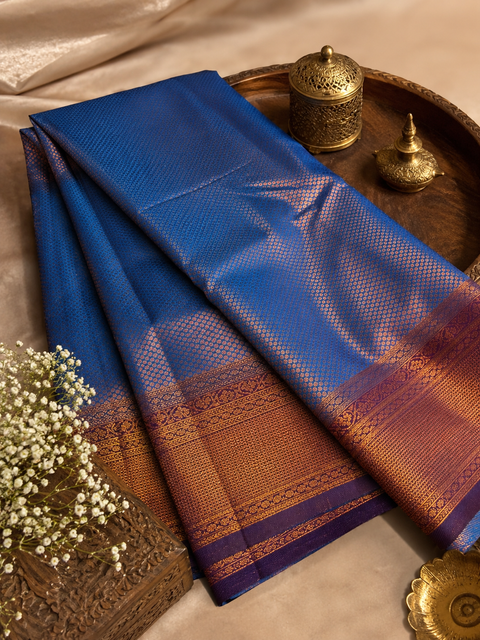 Premium South Silk Saree with rich zari weaving and contrast woven pallu. featuring elegant dual-tone shades.Model-worn blouse is for reference only. Unstitched blouse piece is attached with saree(slight variation in color & design is possible)