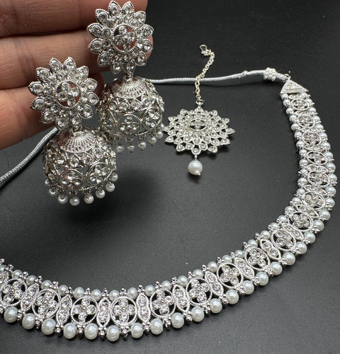 Silver color Beautiful jerkan stone with pearls beaded necklace with jhumka and tikka set