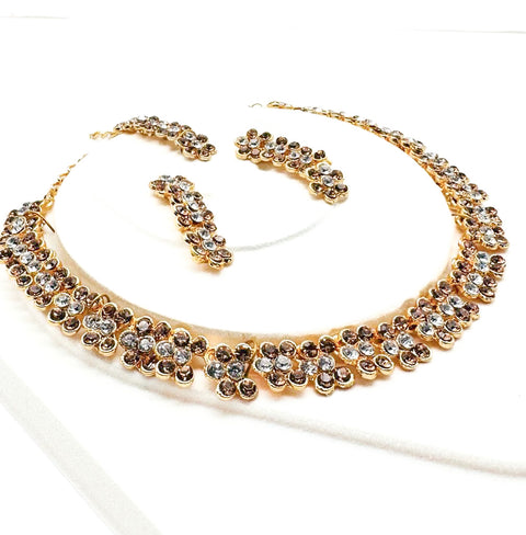 Golden color Jerkan stone studded beautiful necklace set with Earrings & Tikka