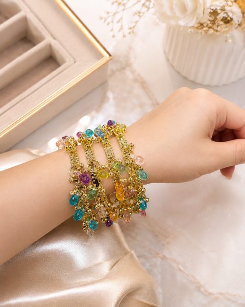 Kashmiri style gold-tone bangles adorned with vibrant crystal charms.Pair these designer bangles with Kashmiri glass bangles to create classy look
(price per set ( 4 bangles in 1 set)(slight variation in color and design is possible)