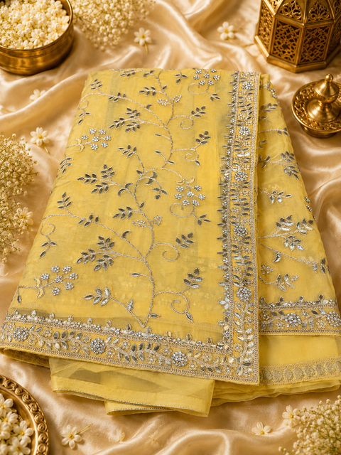 Lite Yellow color Pure and very soft organza tissue based embroidery work jaal all over with stone work & gotta patti beautiful Saree. Model blouse is for reference only; blouse fabric comes with the saree. Slight color and design variations may occur