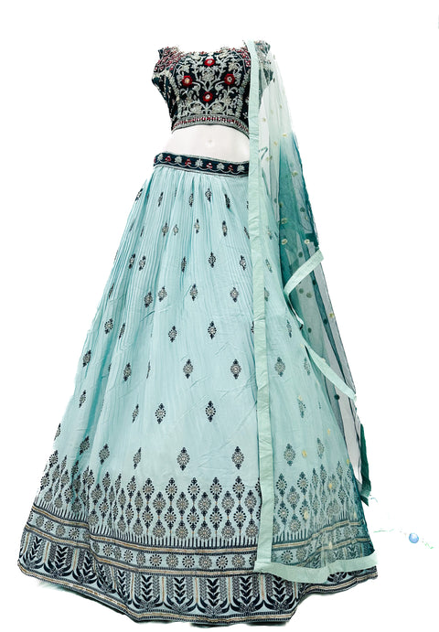 Embroidery with Mirror work silk based designer blouse with heavy flared printed  ken ken lehnga with tessels attached and netting dupatta with lace border and tessels