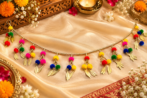Festive Diwali Door Toran – Beautifully designed with colourful pom-poms, pearl detailing and elegant golden hanging accents. Slight variation in colour and design may occur