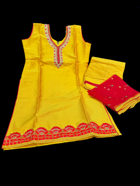 Yellow colour silk based neck work embroidered design with red netting dupatta punjabi suit