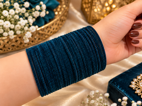 Elegant velvet bangles in a rich Deep Peacock Blue shade, perfect for festive, bridal and traditional looks. Each pack includes 3 dozen bangles (36 pieces). Price is per pack. Slight variation in colour may be possible