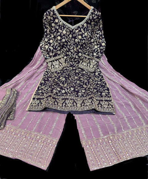 Georgette based sequined and embroidery work kameez with sharara pants and netting dupatta