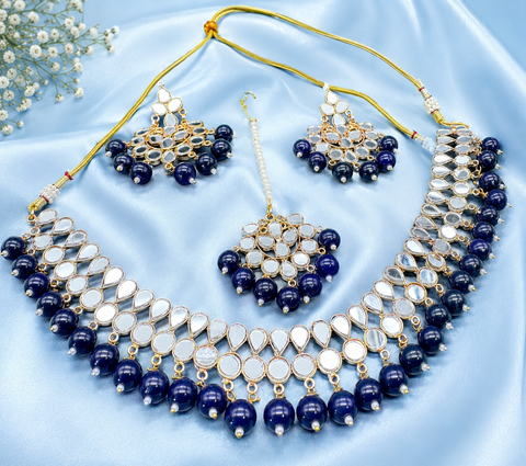 Elegant mirror necklace set adorned with beads and pearl detailing, perfect for adding a royal touch to your traditional look
 ( slight variation in color and design is possible )