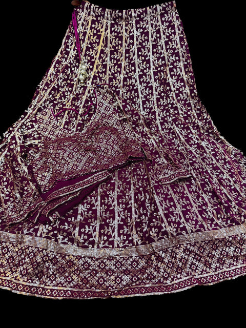 All over embroidery with sequined work heavy design crop top blouse with heavy work multiflared lehnga and netting dupatta