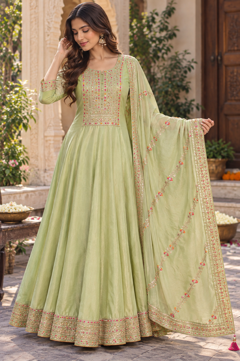 Soft Pistachio Green color Elegant flared Anarkali featuring delicate multicolour embroidery on the neckline, sleeves and hem, paired with a matching embroidered dupatta. Slight variation in colour and design is possible.