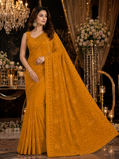 Beautiful Shimmery Georgette Saree featuring elegant embroidery and stone work throughout. Comes with an unstitched matching blouse piece. Model blouse is for reference purpose only. Slight colour and design variations may occur.