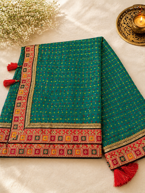 Bandhani print Beautiful Saree with embroidery and stone work border and beautiful design on Pallu with contrast embroidered Blouse. Blouse Piece Attached. Model Image For Reference Only. Slight Variation In Colour And Design May Occur.
