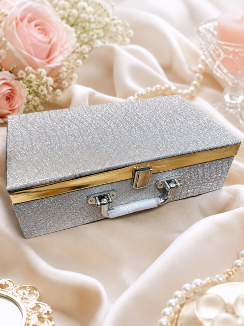 Elegant Silver Jewellery Box.
A beautiful silver-textured jewellery box with luxurious gold detailing and a soft velvet interior, perfect for safely storing and organising your precious bangles and jewellery.
Approx. Size: 30 × 17× 9 Cm.