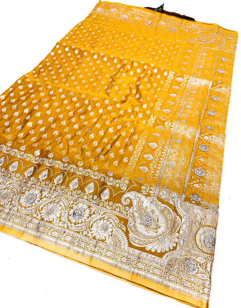 Beautifully designed Banarasi Silk Saree with heavy Handwork with stones & Zari