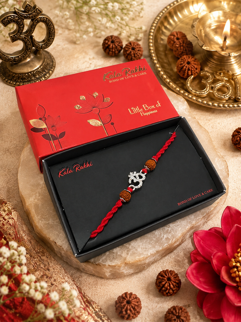 Beautiful Om Rakhi featuring a spiritual centrepiece, Rudraksha beads and elegant gold accents. A meaningful choice to celebrate Raksha Bandhan with blessings, love and tradition.