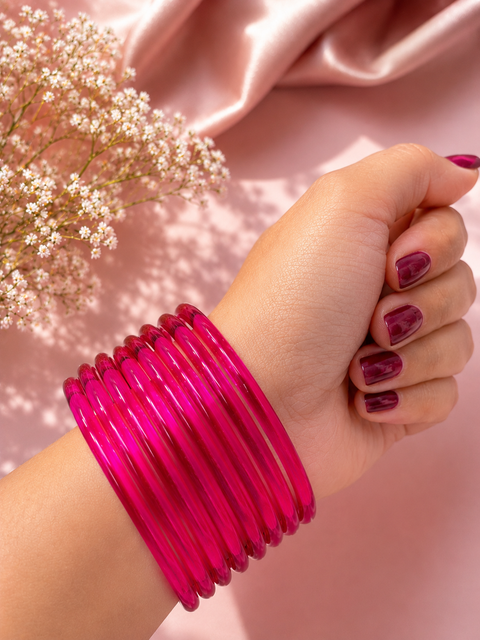 Hot Pink color Ultra-trendy jelly bangles with glossy vibrant shades — the perfect statement stack to elevate your everyday and festive looks (slight variation in color and design is possible) Eight bangles per set (price per set)