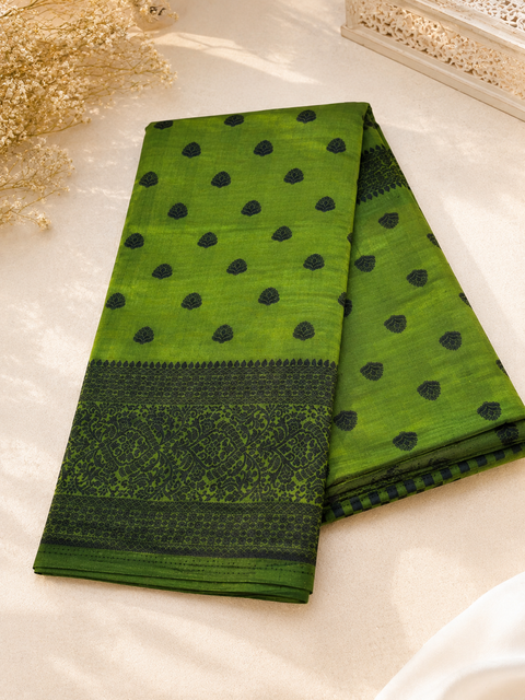 Beautiful semi-silk cotton saree with an elegant woven border and classic motifs. Attached blouse piece included. Slight variation in colour and design may occur.