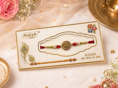 Elegant handcrafted Rakhi with premium beads and sparkling stonework, beautifully crafted to celebrate the special bond of love and protection.