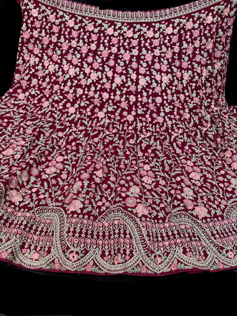 Maroon  colour Georgette based heavy embroidery work with stone work multiflared beautiful bridal lehnga with attached latkans And exact embroidery Potli Bag