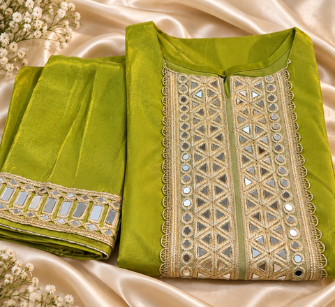 Olive Green Beautiful shimmer Fendy silk suit featuring elegant mirror work detailing on the neckline, sleeves and borders. Paired with matching palazzo pants and a beautifully bordered dupatta. 
 Slight variations in colour and design are possible