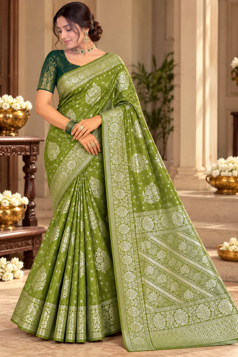 Luxuriously soft silk saree with a smooth, lightweight feel and beautifully flowy drape. Featuring rich woven zari floral motifs and an elegant detailed border .Blouse piece included. Slight variation in colour and design is possible.