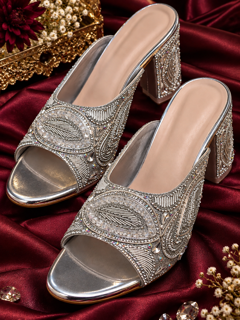 Silver embellished heels with intricate hand embroidery, sparkling stonework and a statement block heel. A classy festive pair that adds the perfect touch of glamour to any outfit.