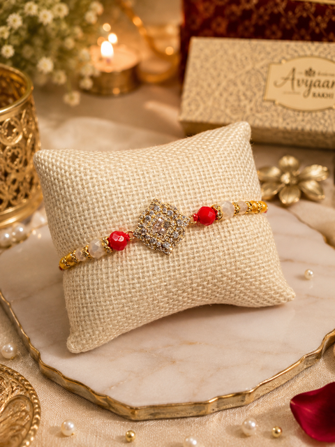 American Diamond Stylish stone designer Rakhi with pearl detailing, presented in a premium gift box
