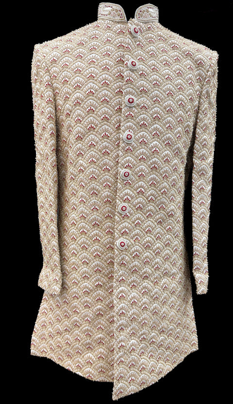 (Video clip attached )Cream based maroon color heavy embroidery & pearl sequined work all over with hand work pearl beaded neck, buttons and sleeves design Sherwani and Pants