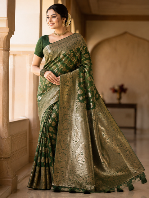Elegant Banarasi Silk Saree with stone-work border. Blouse worn by the model is for reference only; saree comes with its own attached blouse piece. Slight variation in color and design may occur