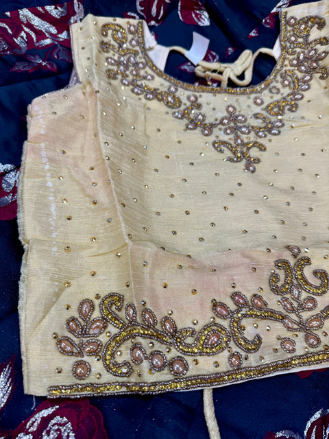 Golden colour raw silk based stone work blouse with brocade silk beautiful lehnga(few red color shades on blouse)