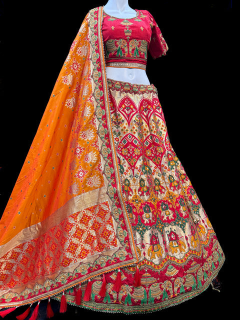 (Video clip attached)SIZE 42 (Upto 44))Multicoloured Banarasi silk Based Beautiful hand Embroidery Work With Golden Fine Stones work heavy Ken Ken Designer semi/Bridal Lehnga With Heavy Tessels Attached To Blouse & Lehnga
