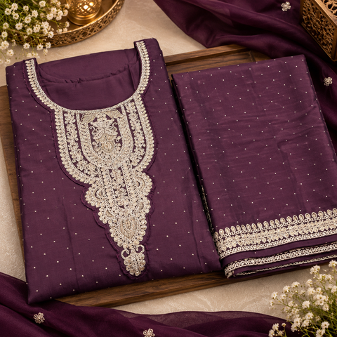 Georgette Silk suit set featuring elegant golden embroidery on the neckline, sleeves and hem, paired with matching pants and a beautifully bordered dupatta.Slight variation in colour and design may be possible.