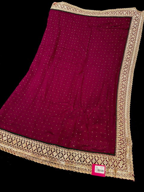 Deep Ruby Beautiful stonework and embroidery work border design beautiful very soft Georgette Saree with stones work all over and contrast blouse peacock Blue color (slight variation in color is possible)