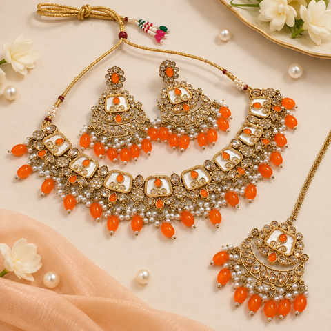 Beautiful polki stones with pearls and colorful stones necklace & earrings with Tikka. Slight variations in colour and design are possible