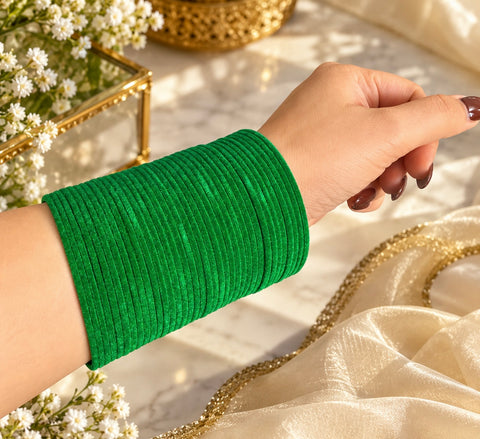 Elegant velvet bangles in a rich Green shade, perfect for festive, bridal and traditional looks. Each pack includes 3 dozen bangles (36 pieces). Price is per pack. Slight variation in colour may be possible