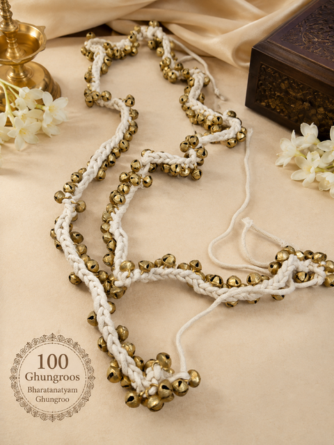 Traditional 100 Ghungroo Bharatanatyam Ghungroo 
Beautifully crafted with 100 golden ghungroo bells on soft, braided cotton cords, designed to create a rich and rhythmic sound with every movement.
