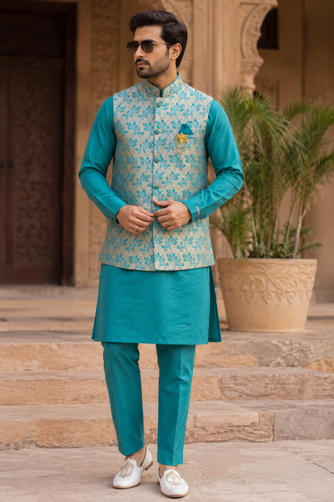 Premium Teal Kurta Set with an Elegant Floral Jacquard Nehru Jacket, designed to bring timeless charm and sophistication to every festive occasion. Slight variation in color and design may occur.