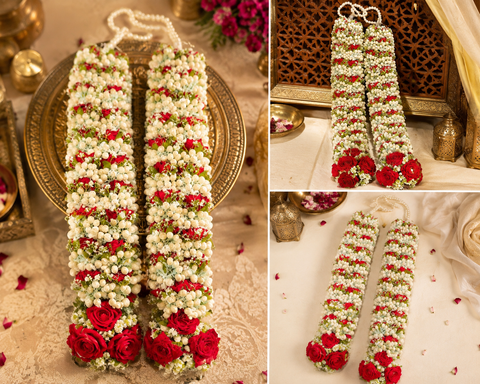 Beautifully Red Roses with heavy crafted Mogra flowers and pearls Varmala / Jailmala , featuring elegant floral detailing and rich traditional accents. A perfect choice to add a graceful touch to your special wedding ceremony.(comes in one pair)